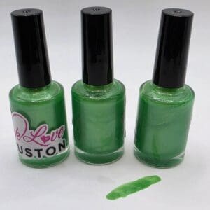 Three green nail polish bottles and swatch.