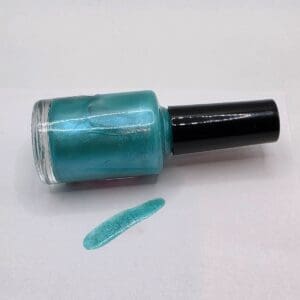 Turquoise nail polish bottle with swatch.
