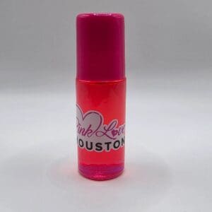 Pink Love Houston perfume bottle on display.